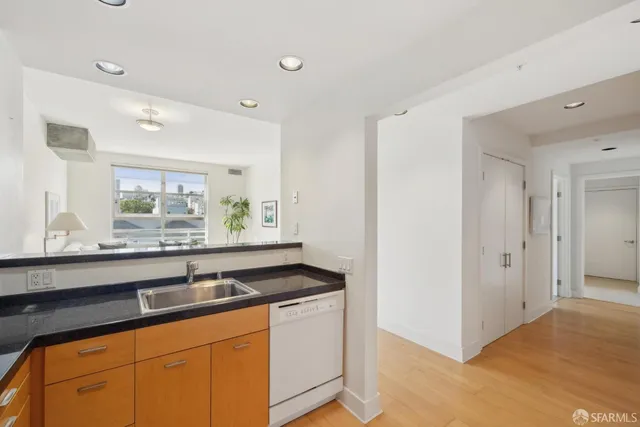 a view of a kitchen with washer and dryer