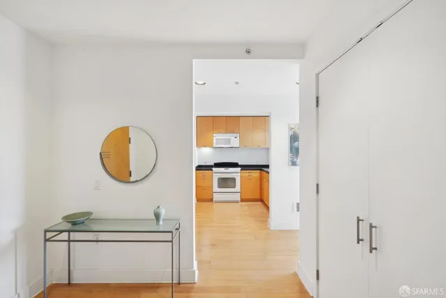 a kitchen with stainless steel appliances granite countertop a stove and a refrigerator