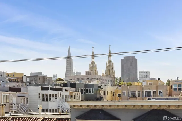 a view of a living room and chandelier