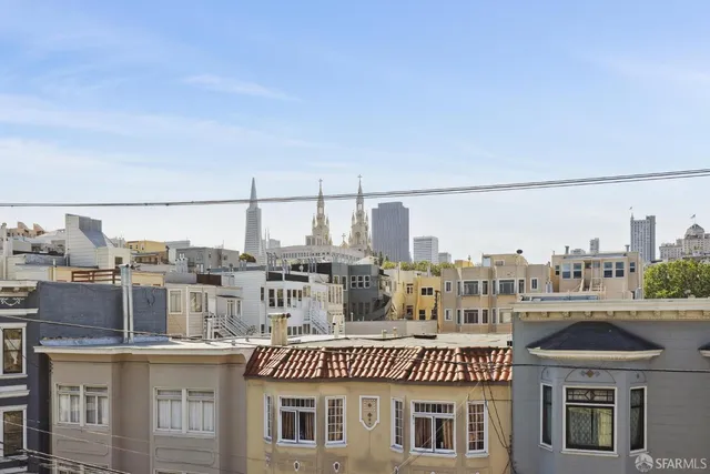 a living room with furniture and a lamp