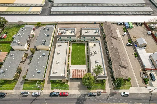 an aerial view of residential houses with outdoor space