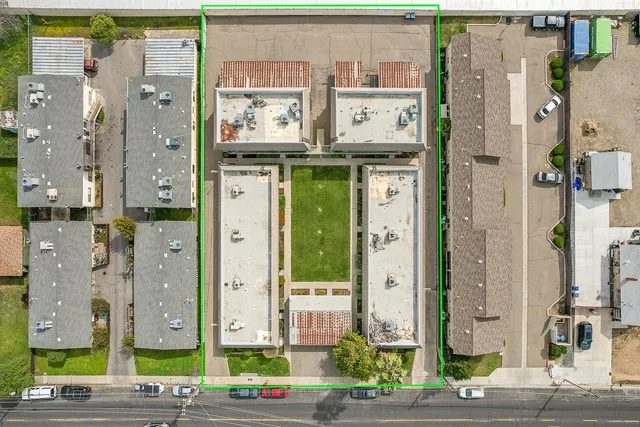 an aerial view of residential houses with outdoor space