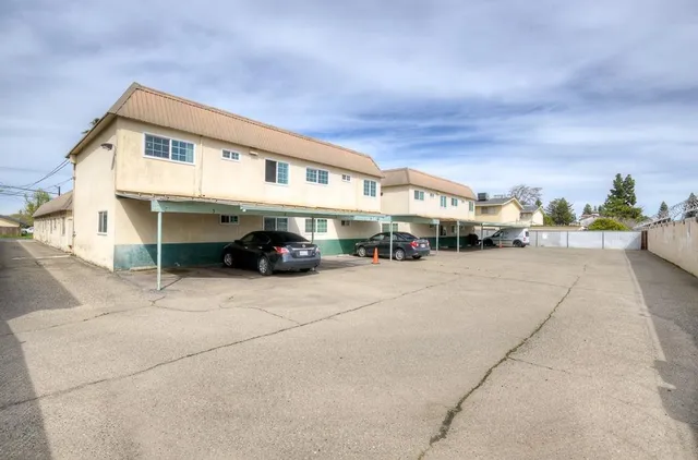 a view of a street with cars