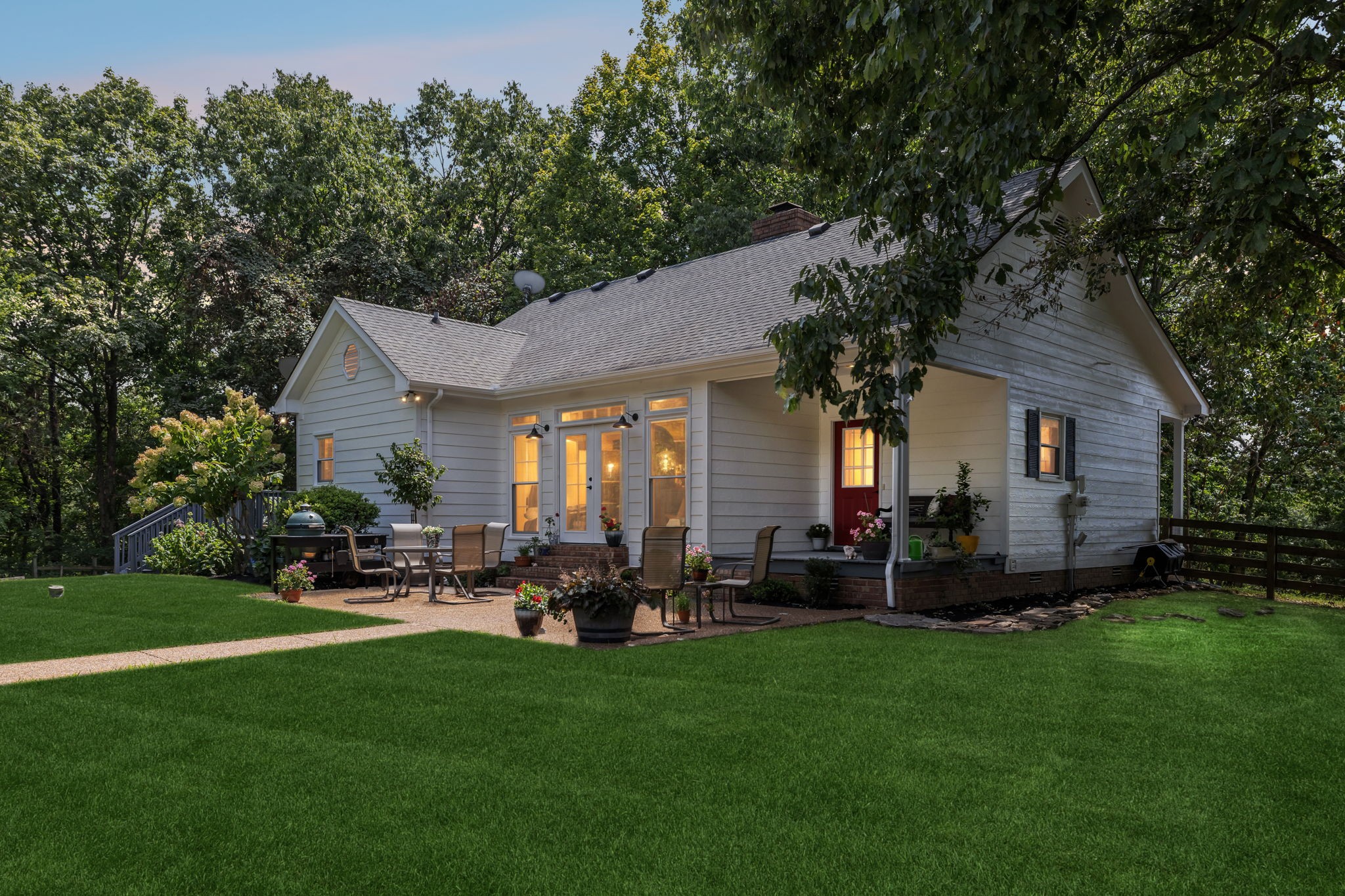 1712 Sugar Ridge Road Spring Hill, TN 37174 - Photo 3 of 65 a front view of a house with a garden and outdoor seating
