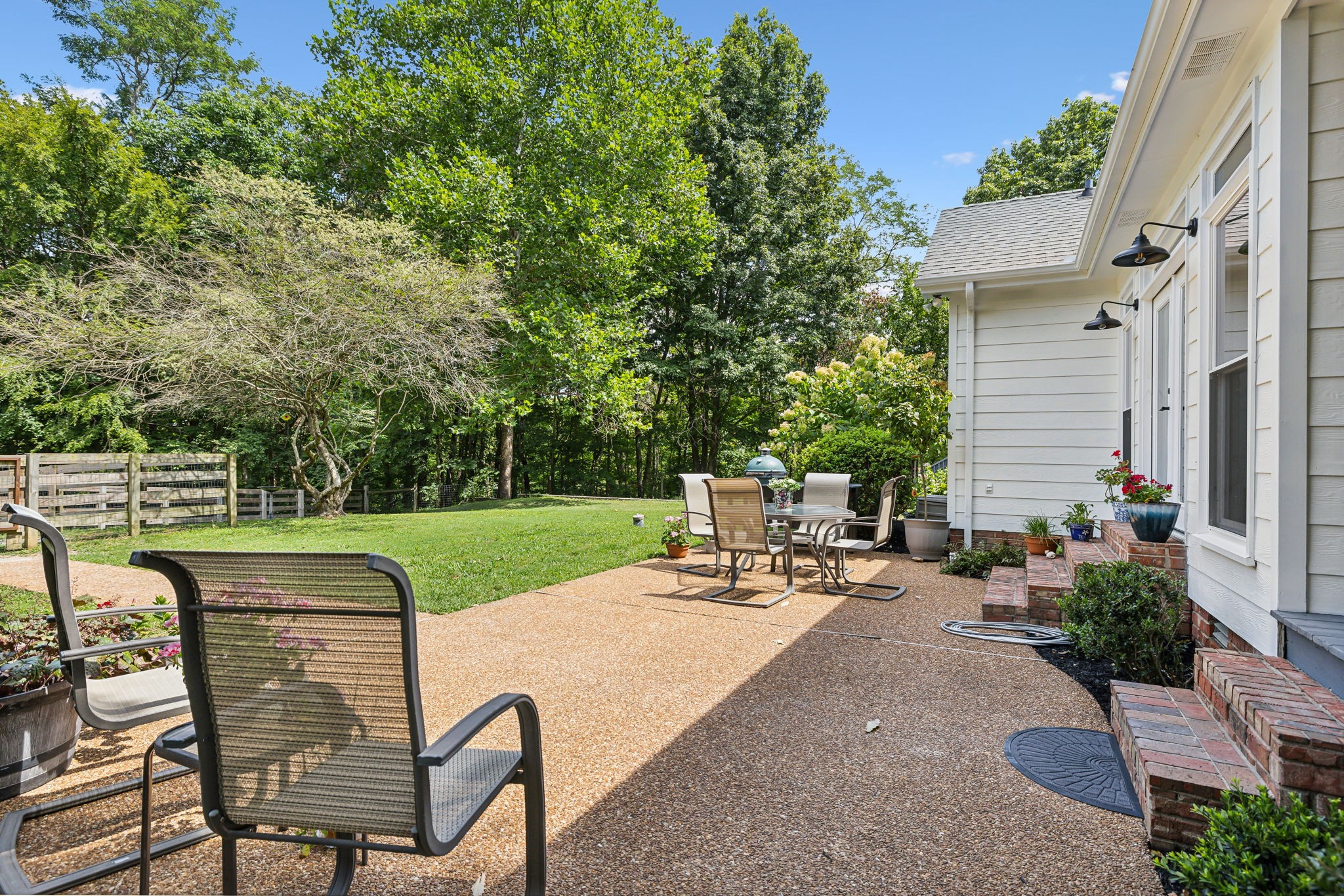 1712 Sugar Ridge Road Spring Hill, TN 37174 - Photo 48 of 65 a view of a chairs and table in the back yard of the house