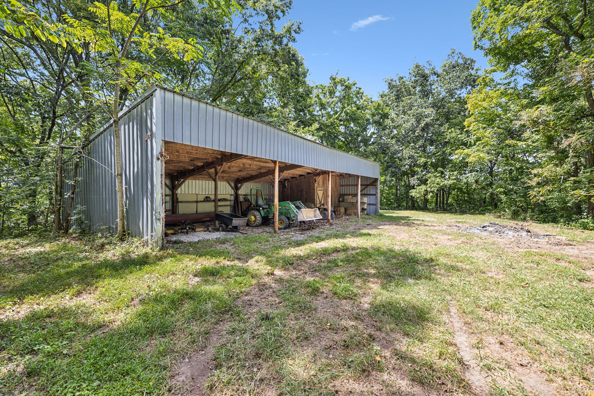 1712 Sugar Ridge Road Spring Hill, TN 37174 - Photo 54 of 65 a backyard of a house with table and chairs