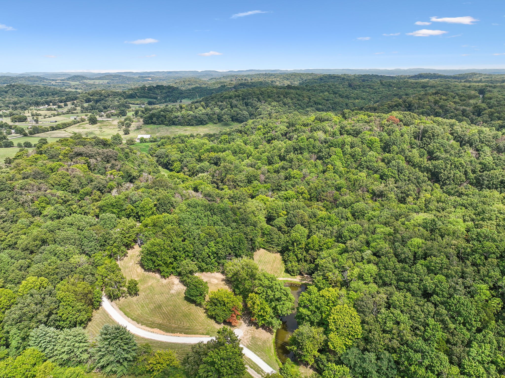 1712 Sugar Ridge Road Spring Hill, TN 37174 - Photo 64 of 65 a view of a field with an outdoor space and seating