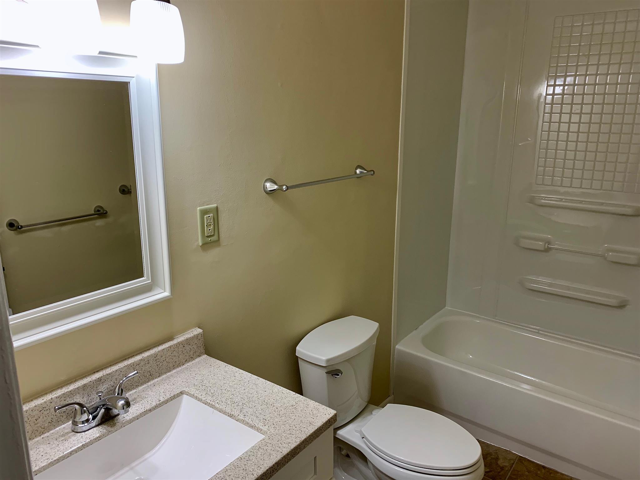 1163 Lawrence Road Murfreesboro, TN 37128 - Photo 10 of 12 Brand new vanity and top with updated fixtures, new vinyl flooring, and custom framed mirror!