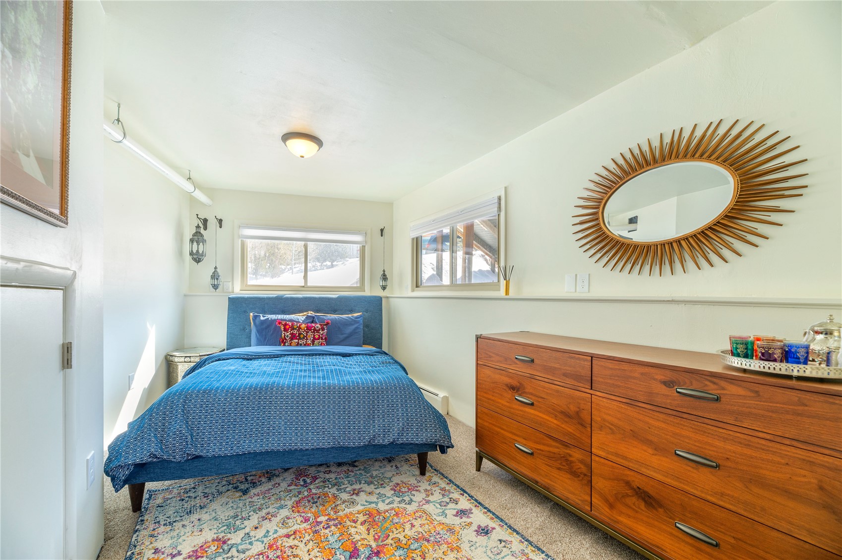 340 Buffalo Street Dillon, CO 80435 - Photo 33 of 40 a bedroom with a bed and a dresser