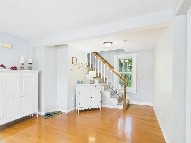 a view of an entryway with wooden floor