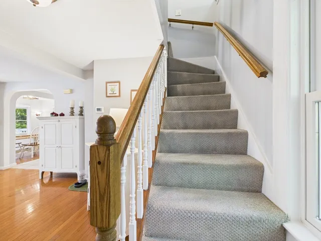 a view of staircase with white walls