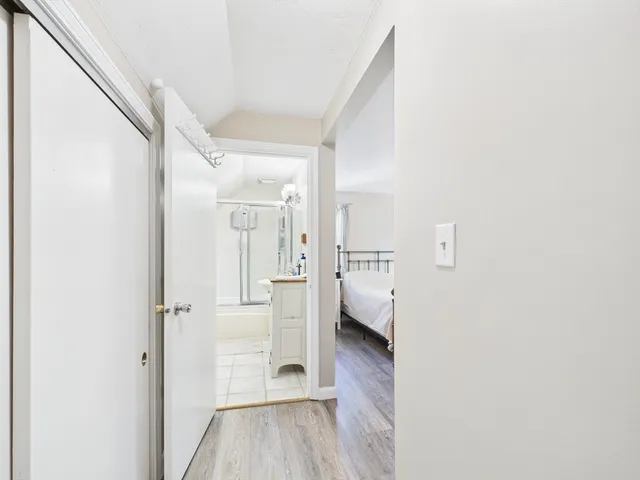 a view of a bathroom with a sink and a mirror