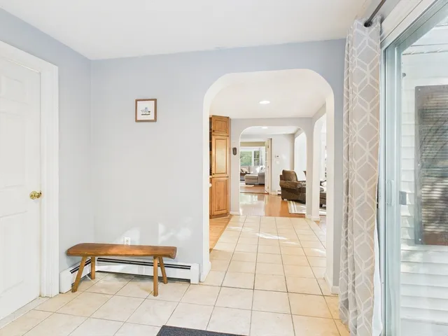 a hallway with a furniture and a rug