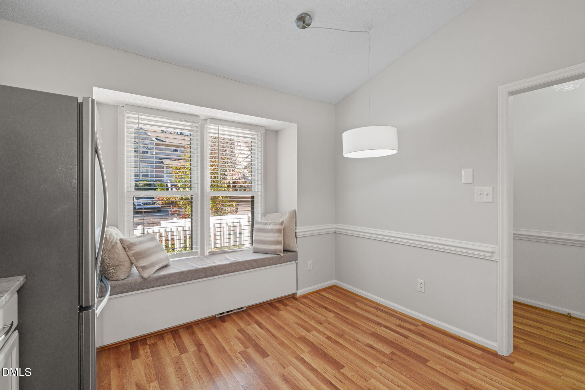 1424 Mapleside Court Raleigh, NC 27609 - Photo 19 of 72 a view of an empty room with wooden floor and a window