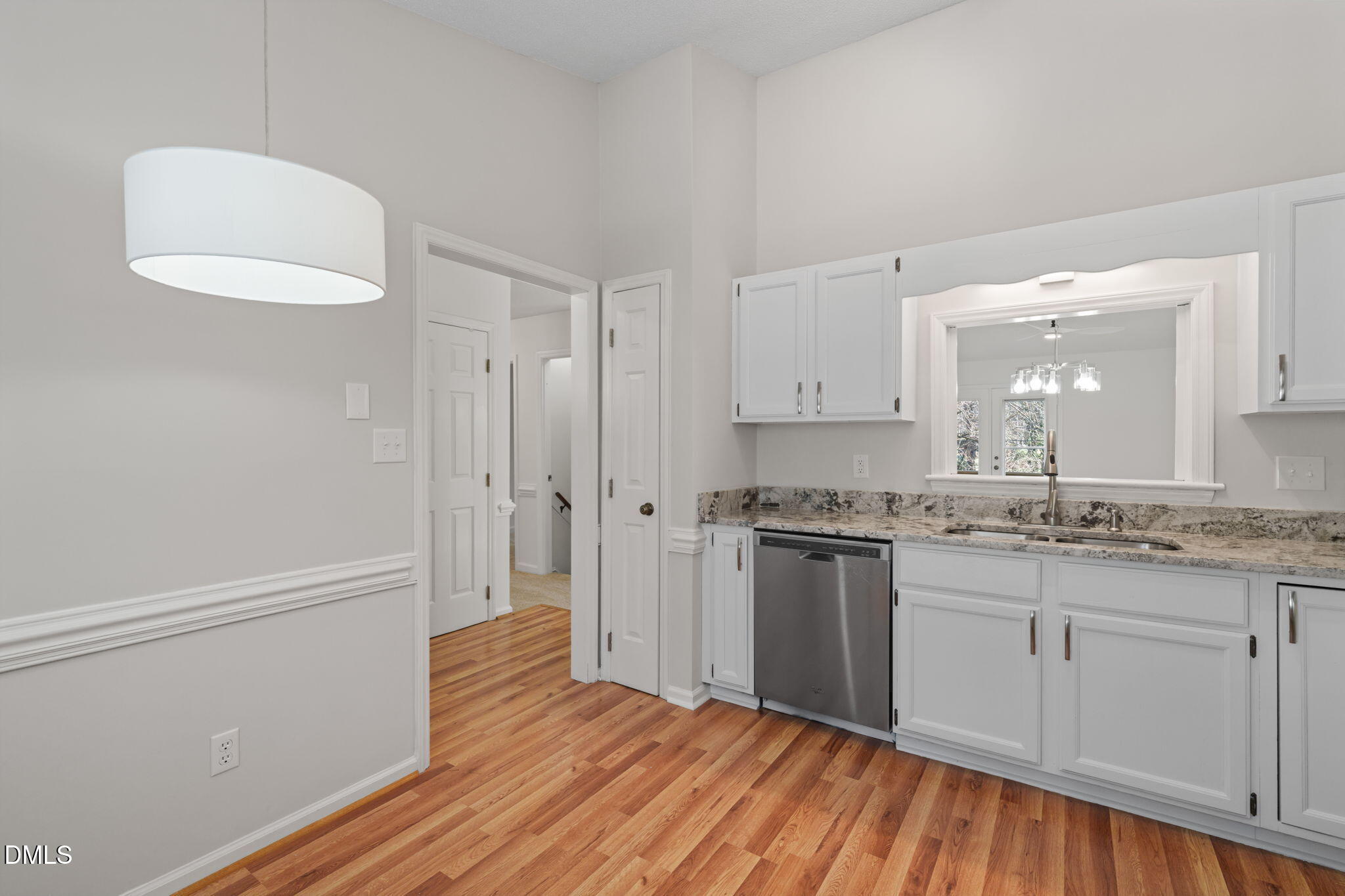1424 Mapleside Court Raleigh, NC 27609 - Photo 20 of 72 a kitchen with a refrigerator and a stove top oven