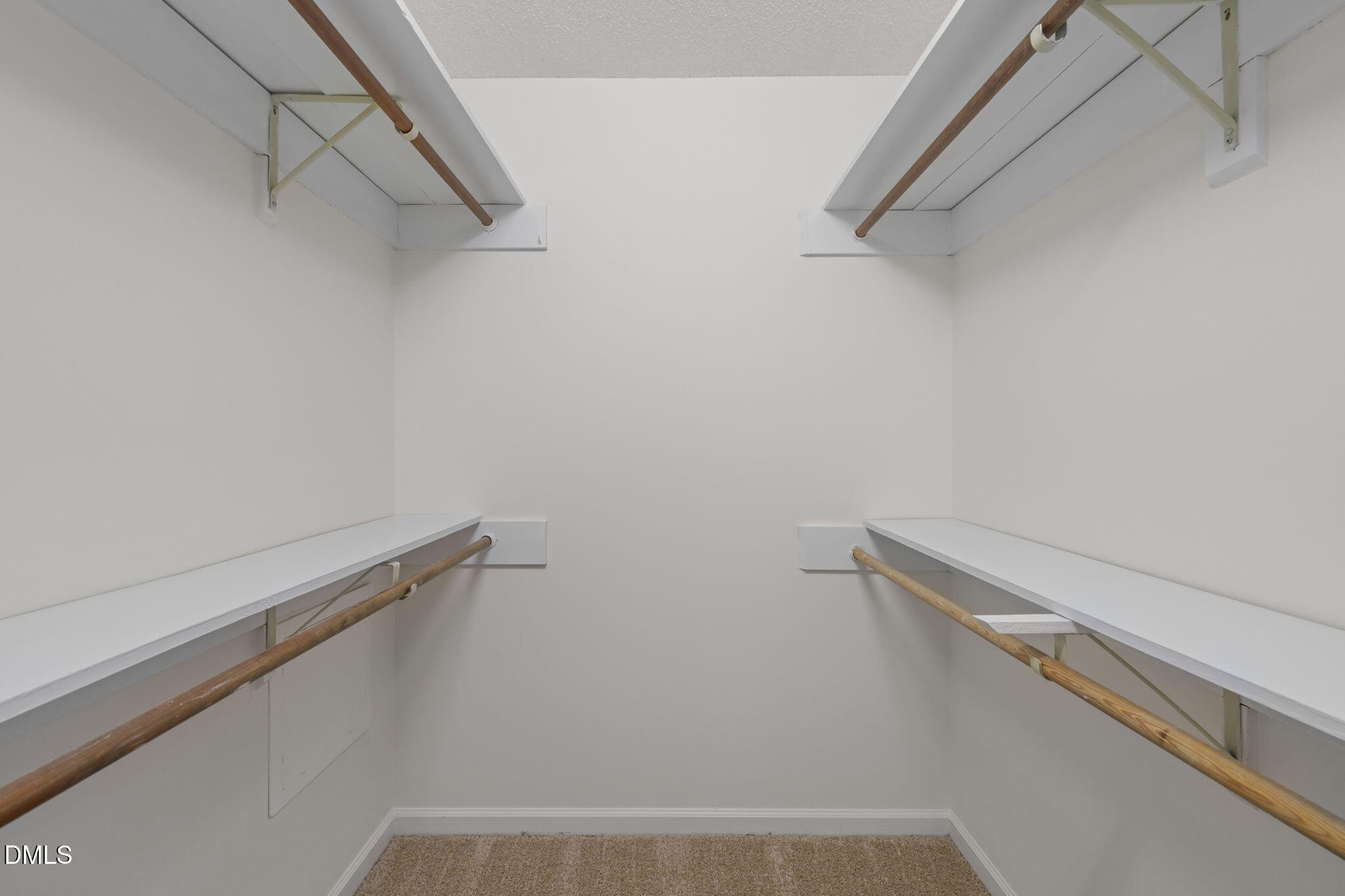 1424 Mapleside Court Raleigh, NC 27609 - Photo 25 of 72 a view of a room with racks on the wall