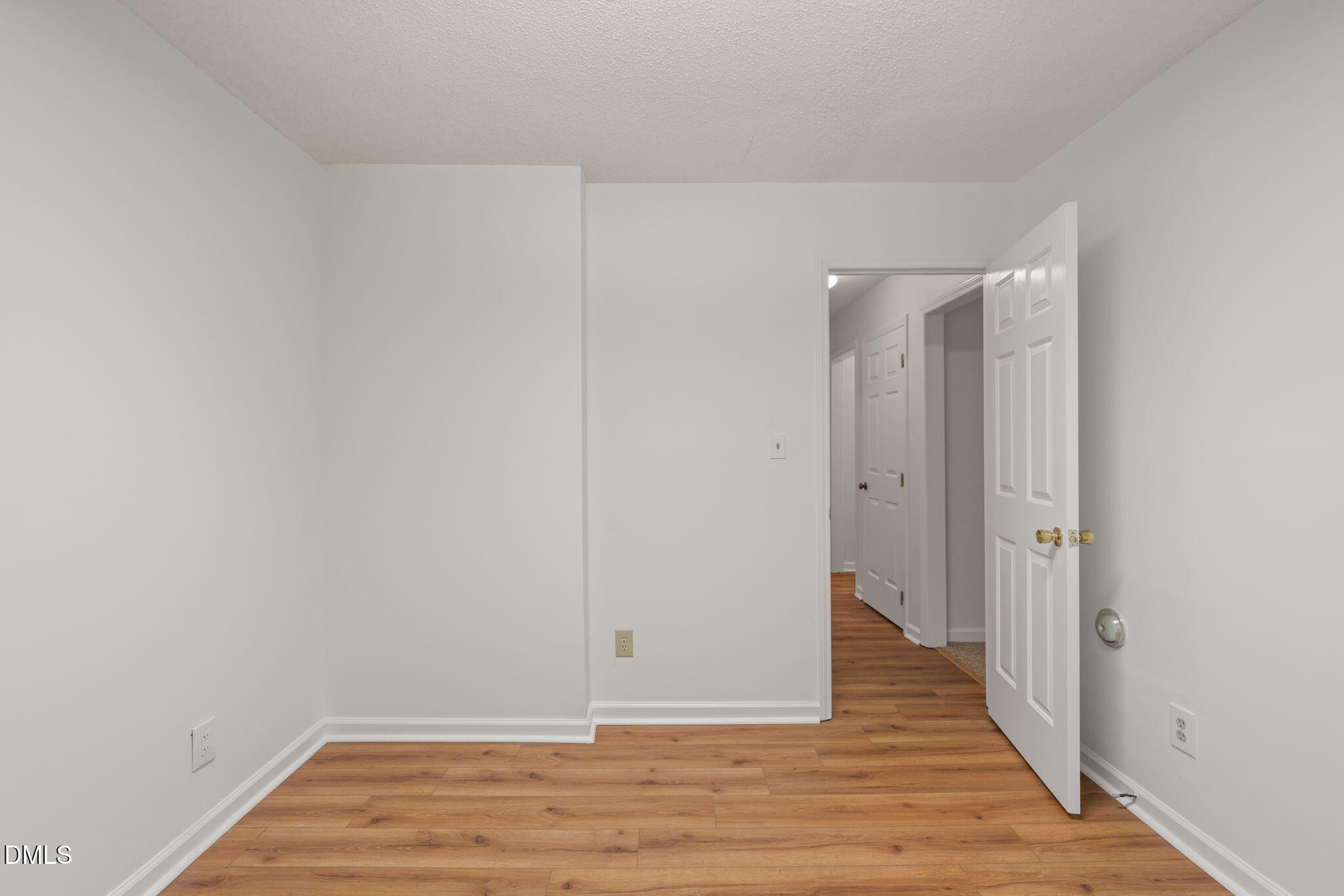 1424 Mapleside Court Raleigh, NC 27609 - Photo 33 of 72 a view of an empty room with wooden floor