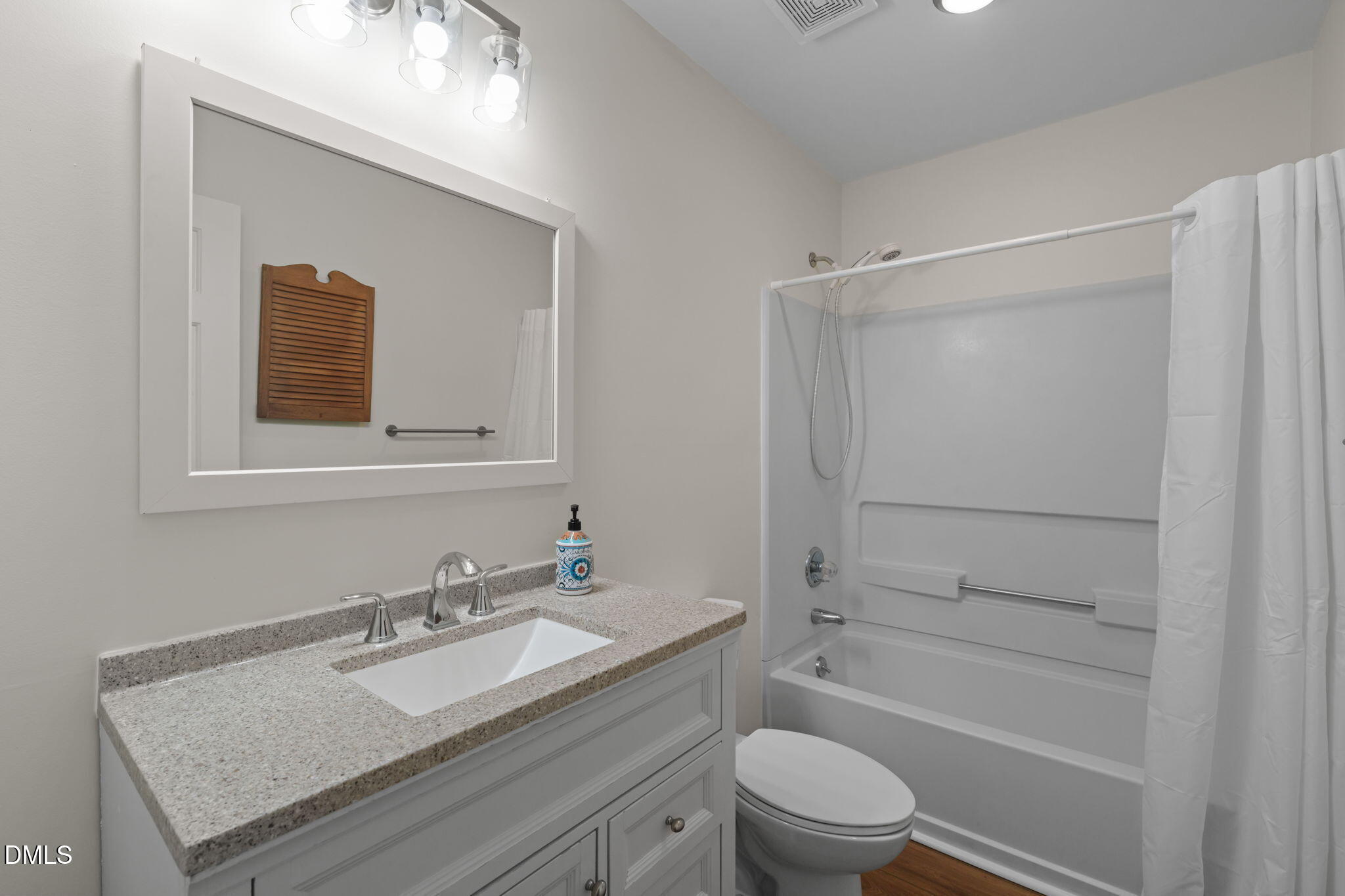 1424 Mapleside Court Raleigh, NC 27609 - Photo 34 of 72 a bathroom with a granite countertop sink toilet and shower