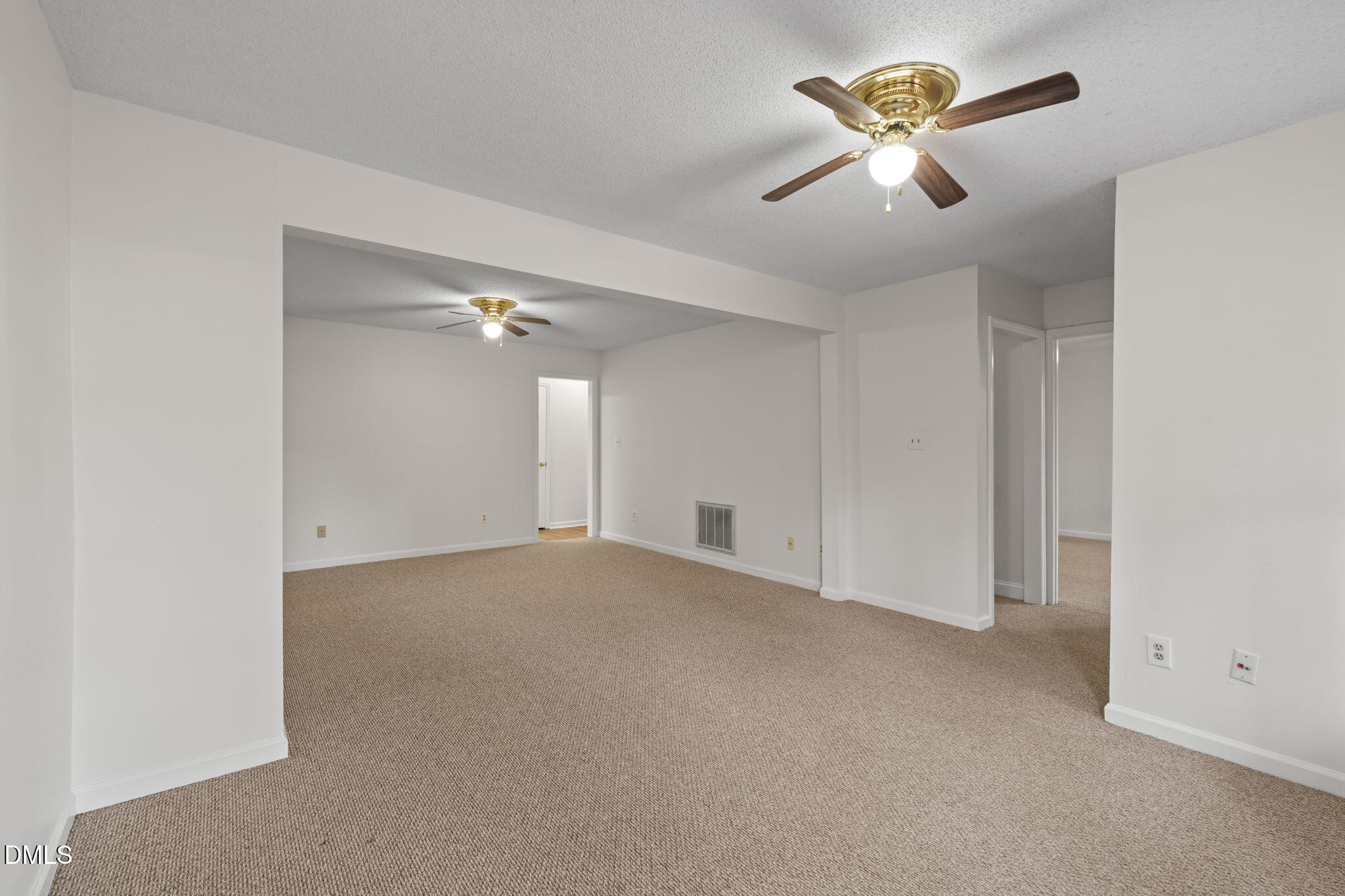 1424 Mapleside Court Raleigh, NC 27609 - Photo 37 of 72 an empty room with closet and a chandelier fan