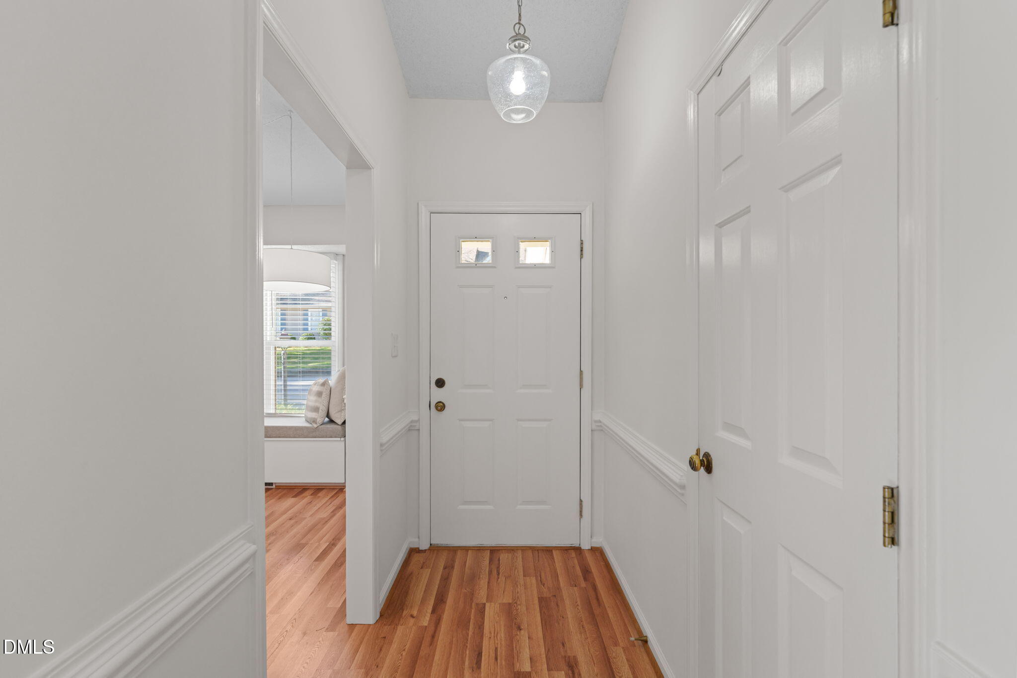 1424 Mapleside Court Raleigh, NC 27609 - Photo 40 of 72 a view of a hallway with wooden floor and a bathroom