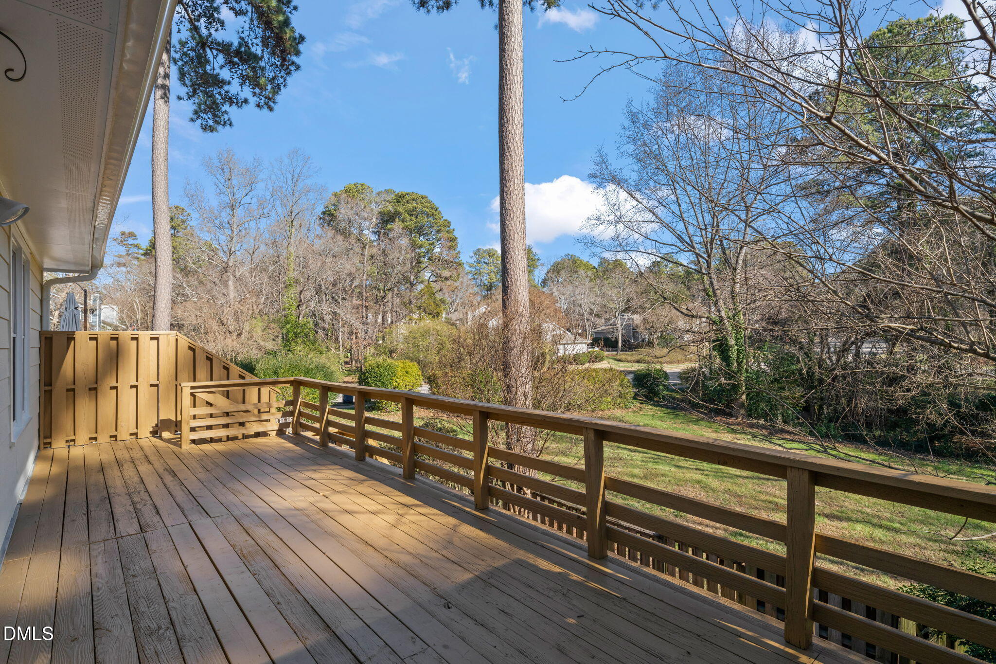 1424 Mapleside Court Raleigh, NC 27609 - Photo 42 of 72 a view of a balcony with wooden floor next to a yard
