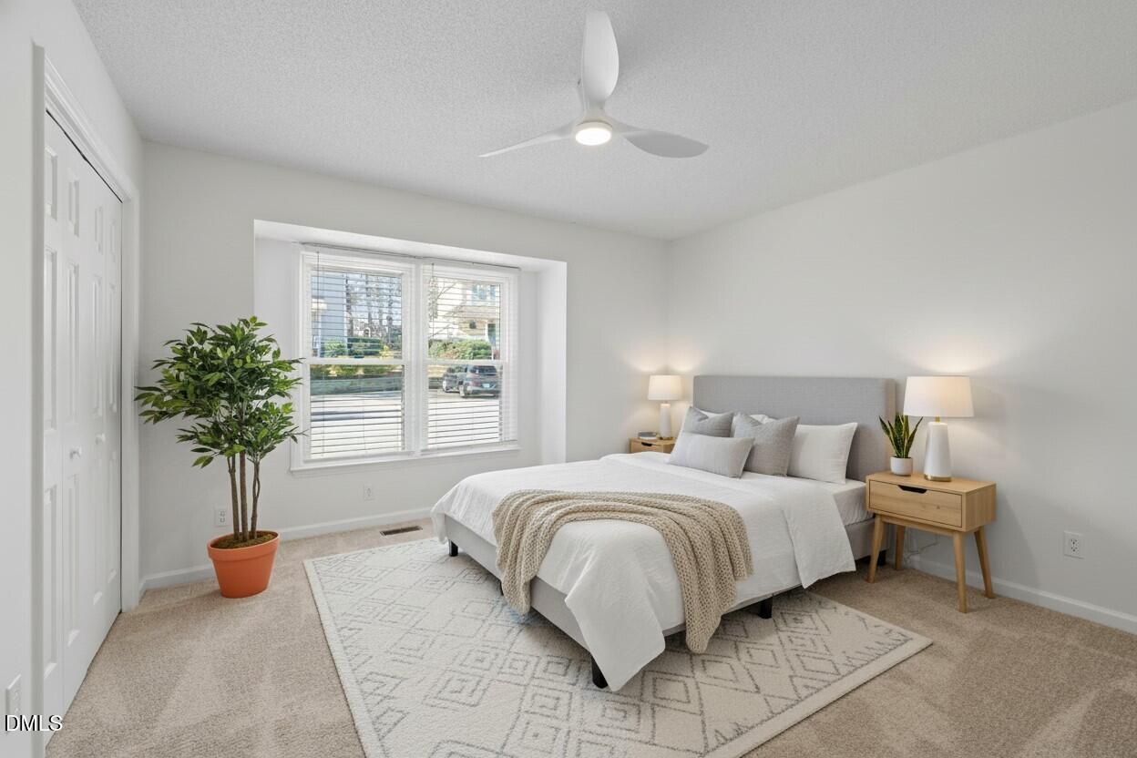 1424 Mapleside Court Raleigh, NC 27609 - Photo 6 of 72 a bedroom with a bed and a window