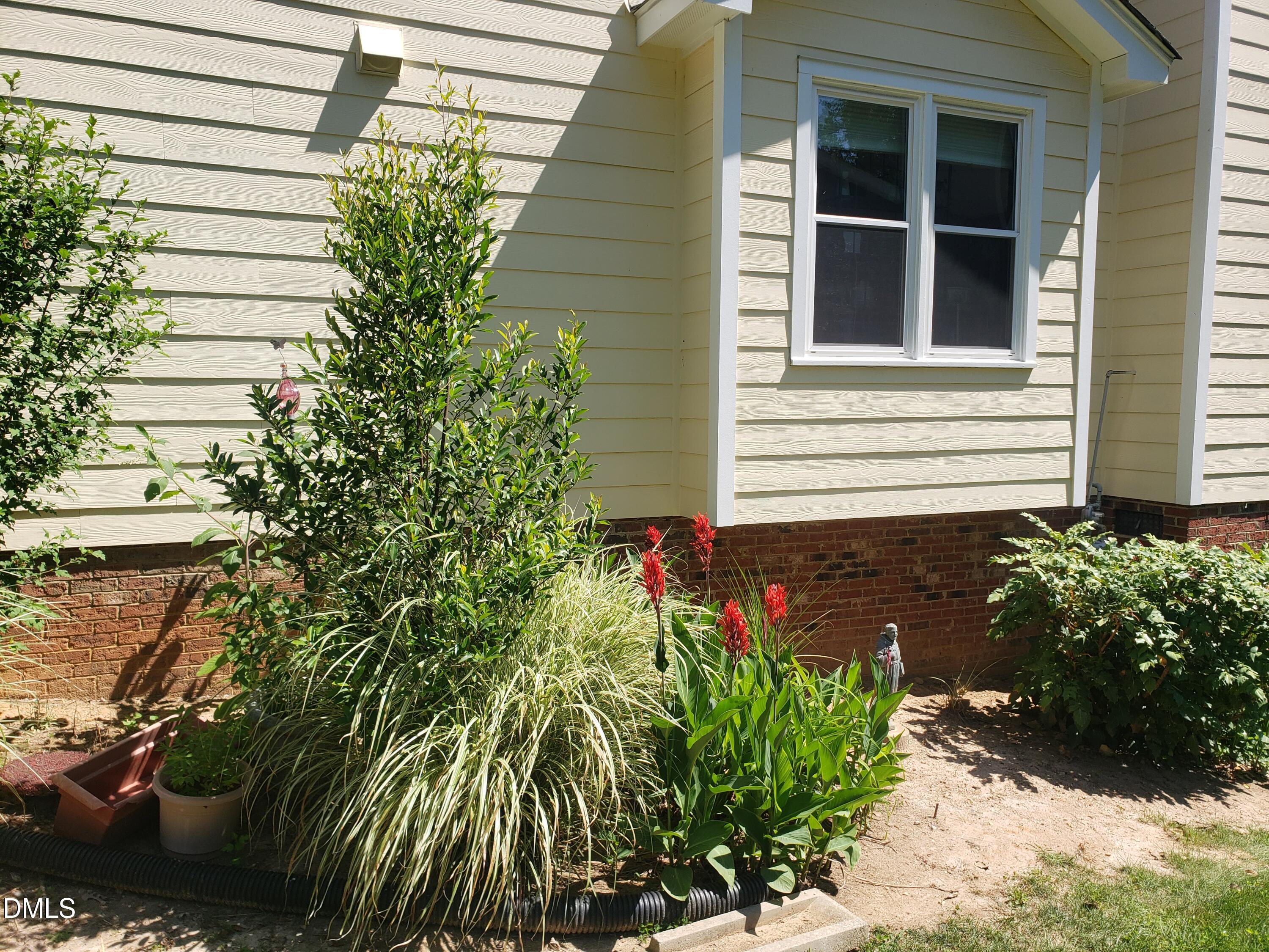 1424 Mapleside Court Raleigh, NC 27609 - Photo 61 of 72 a front view of a house with a yard and garden