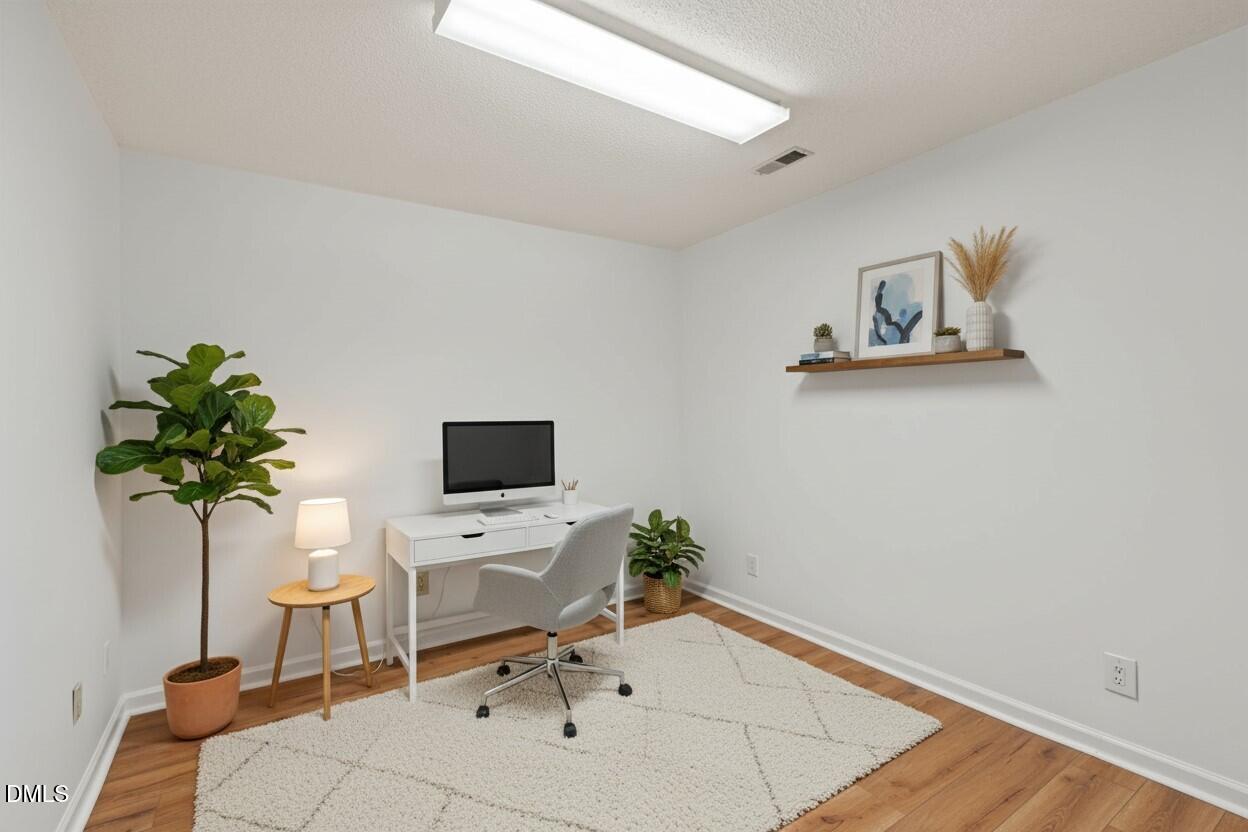 1424 Mapleside Court Raleigh, NC 27609 - Photo 8 of 72 a living room with furniture and a potted plant