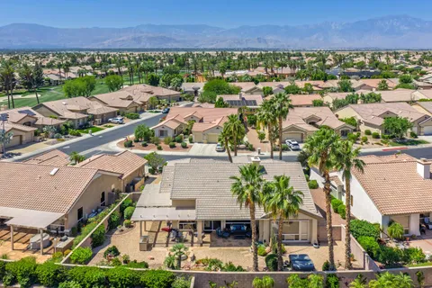 an aerial view of residential houses and outdoor space