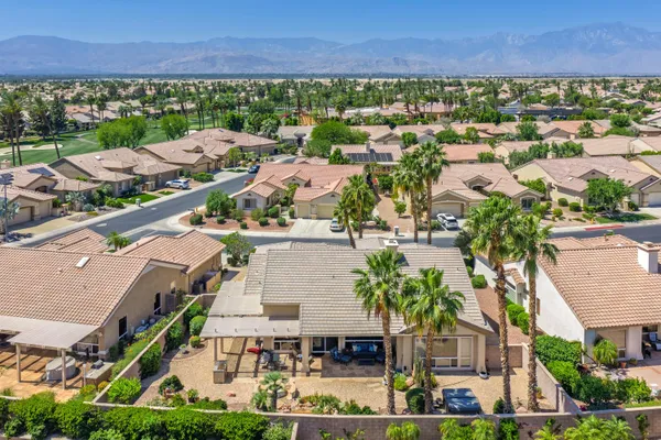 an aerial view of residential houses and outdoor space