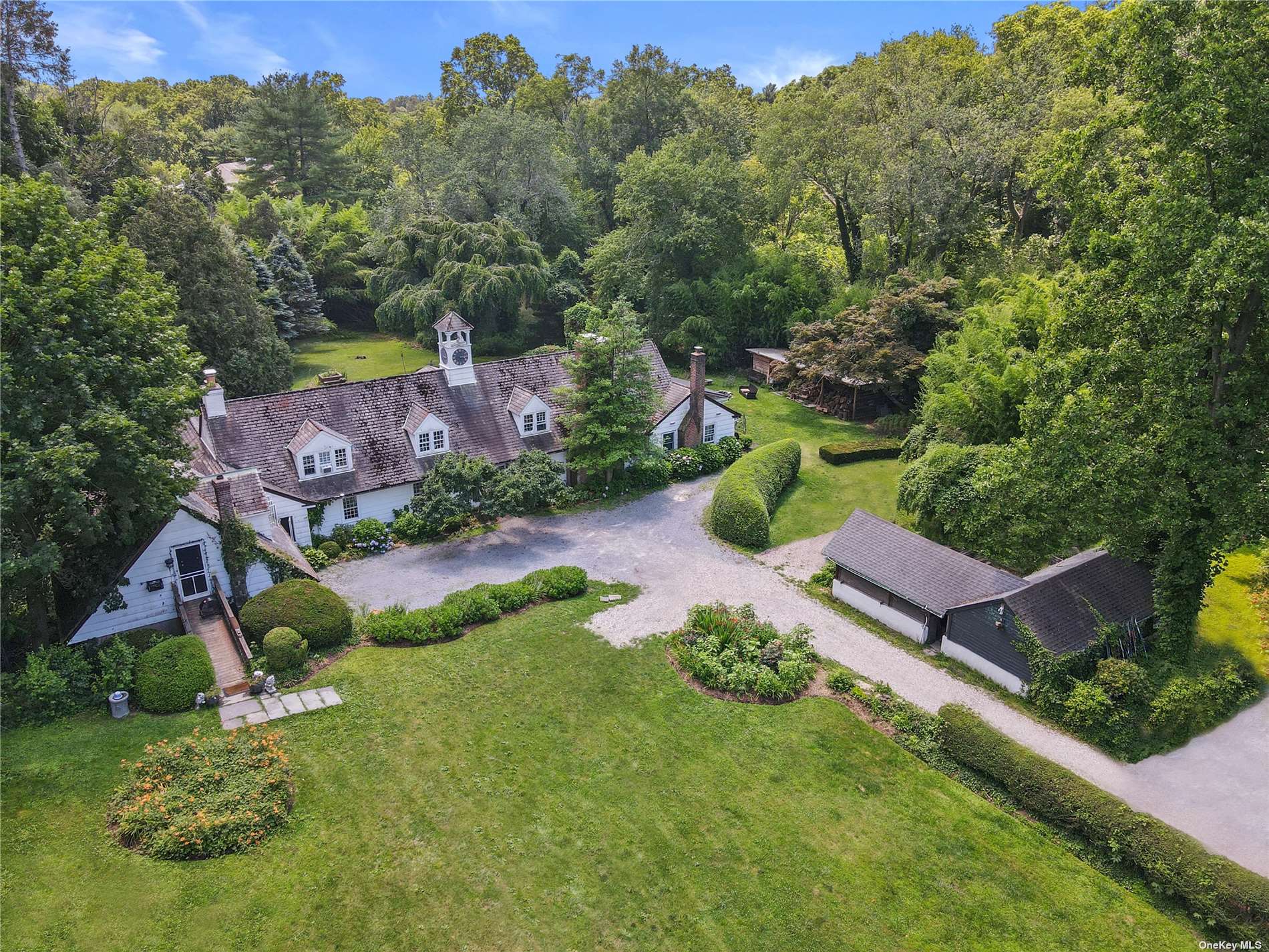 16 Underhill Road Locust Valley, NY 11560 - Photo 1 of 1 an aerial view of a house with a yard