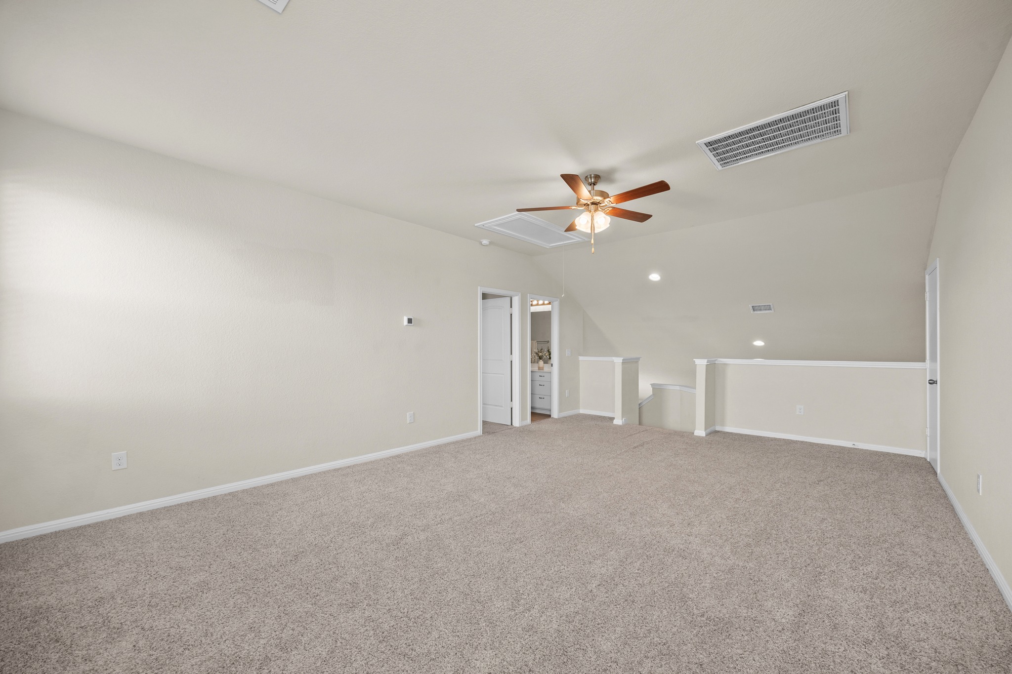2413 Starhill Ranch Street Georgetown, TX 78628 - Photo 27 of 40 a view of an empty room with a chandelier fan