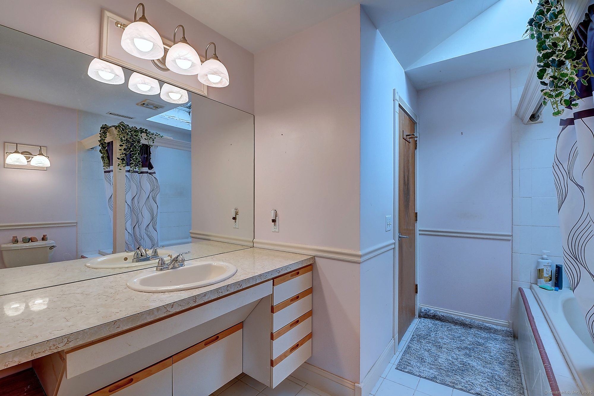 35 Weekeepeemee Road Bethlehem, CT 06751 - Photo 20 of 40 a bathroom with a sink and a mirror