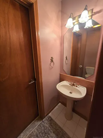 a bathroom with a sink a toilet and vanity