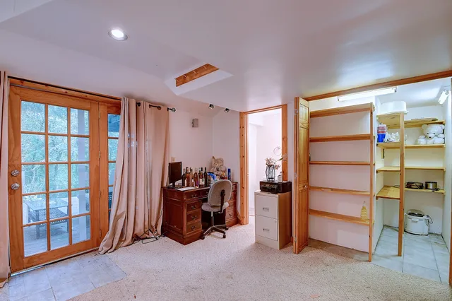 a view of a livingroom with furniture and staircase
