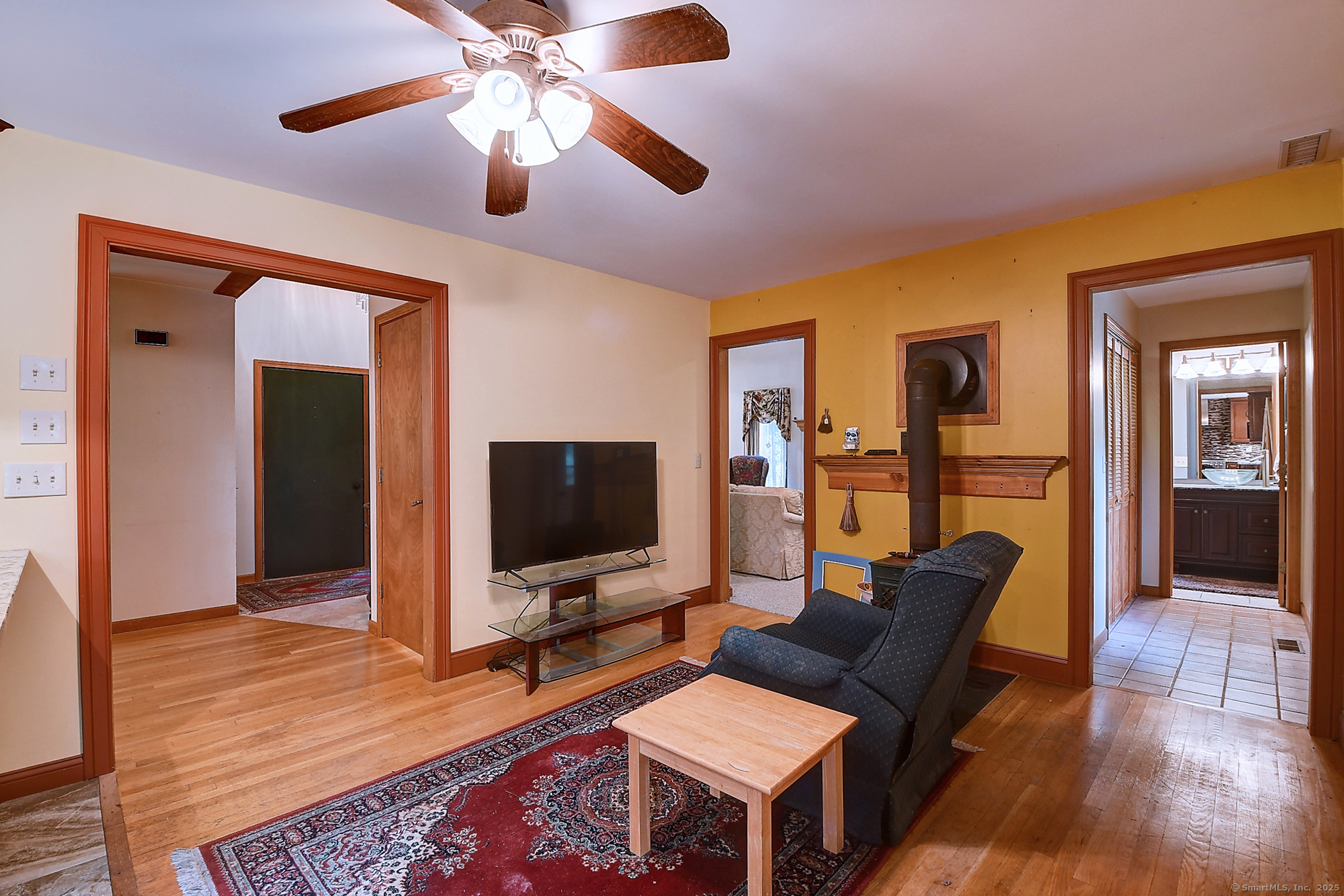 35 Weekeepeemee Road Bethlehem, CT 06751 - Photo 7 of 40 a living room with furniture and a flat screen tv