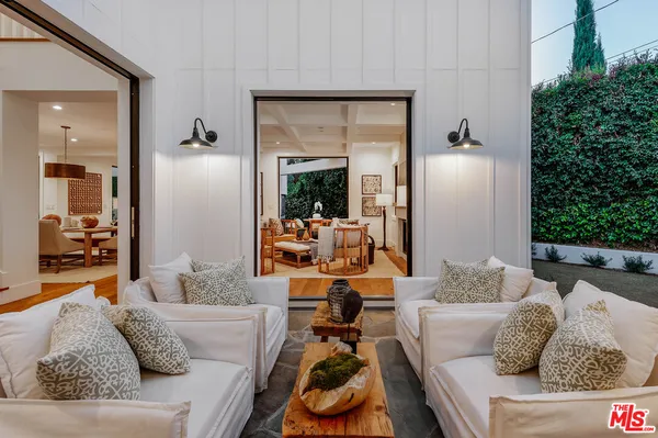 a lobby with furniture and floor to ceiling window