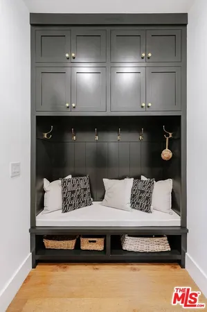 a living room with furniture and a lamp