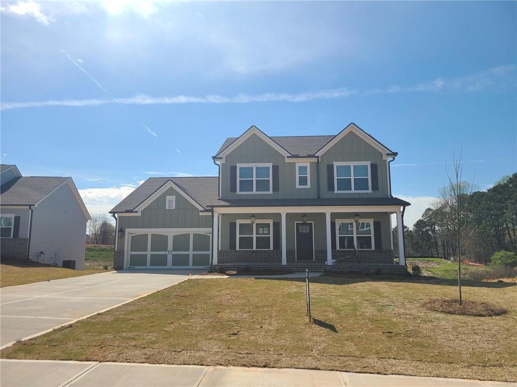 917 Calgary Court Winder, GA 30680 - Photo 1 of 1 a front view of a house with a garden