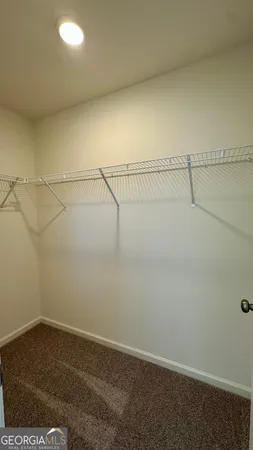 a view of a room with racks on the wall