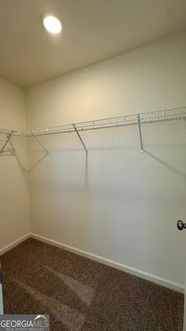 a view of a room with racks on the wall