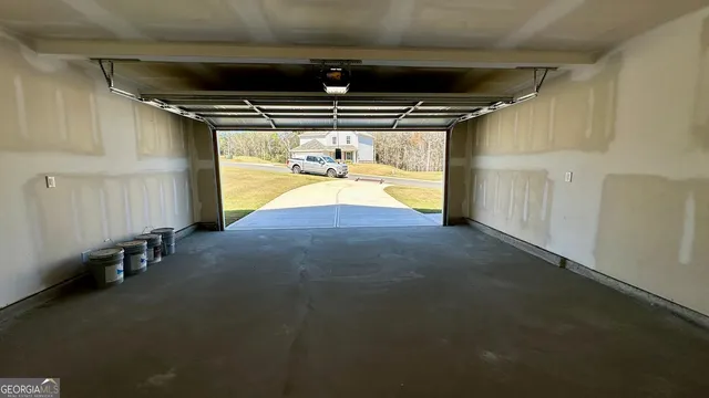 a view of water heater and a refrigerator