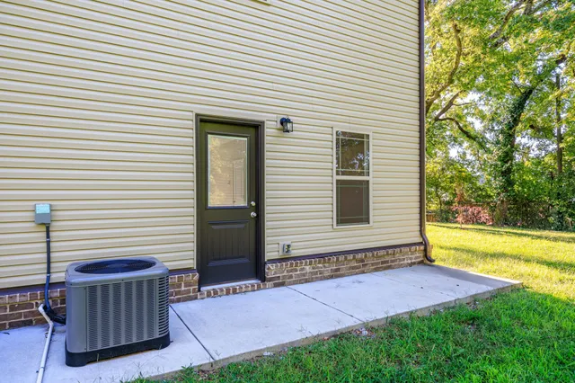 a view of a backyard with a garden and trees
