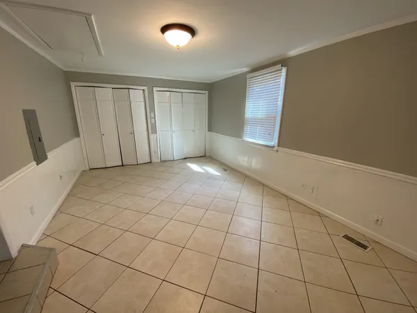 a view of an empty room with a window