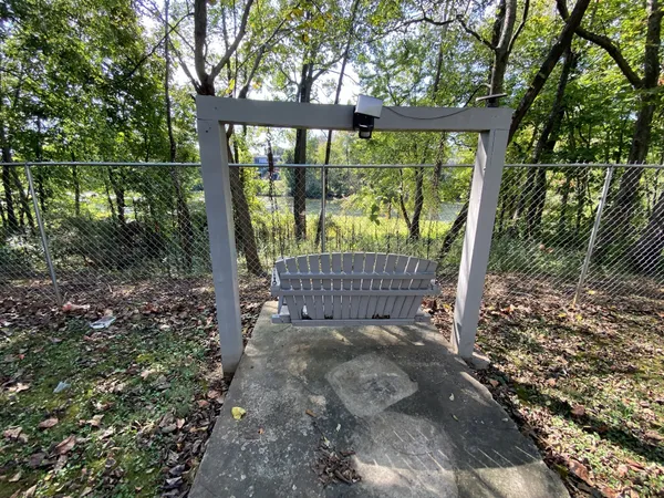 a view of a yard with a tree in the background