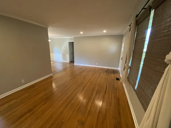 a view of gallery with wooden floor