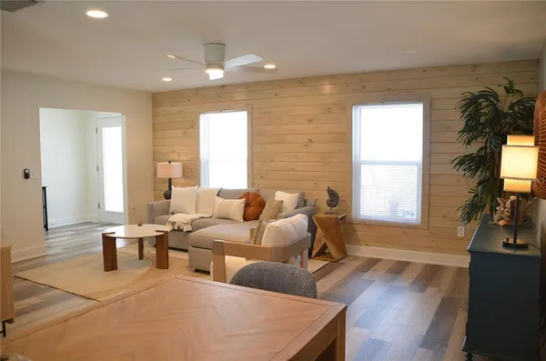 a view of a dining room with furniture window and wooden floor