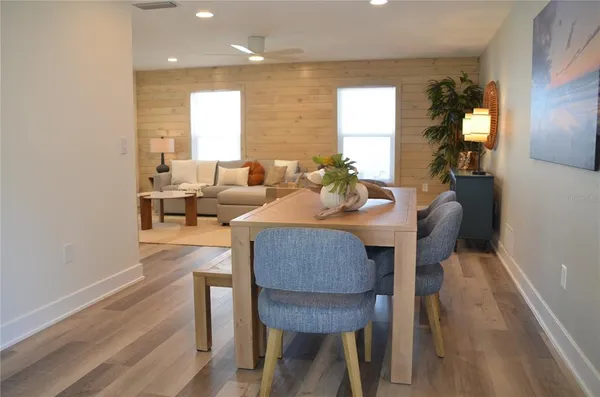 a kitchen with white cabinets and a sink