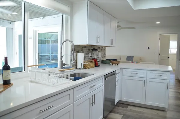 a kitchen with a refrigerator stove and microwave