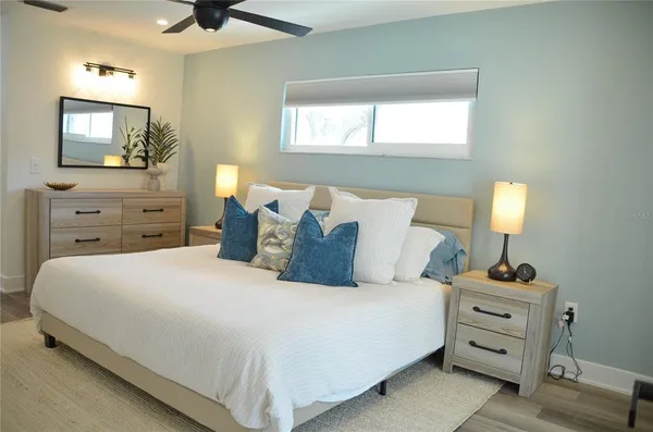a bedroom with a bed and a dresser